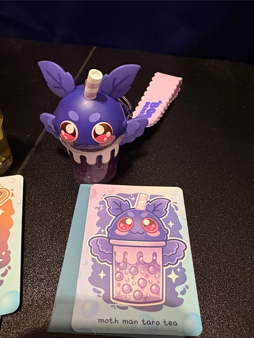 Moth Man Taro Tea Collectible Keychain - Purple set of toy keychains unboxed